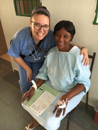 Alex Boulton, a sophomore nursing student at Nebraska Methodist College, poses with a Haitian woman after placing an IV in her hand. Alex Boulton, a sophomore nursing student at Nebraska Methodist College, poses with a Haitian woman after placing an IV in her hand.
