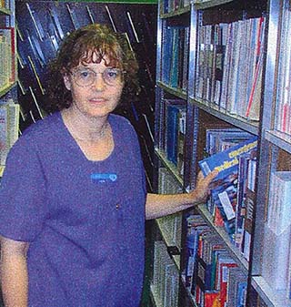 In this historic photo, Nebraska Methodist College Library Assistant Tem Adair checks the stacks. In this historic photo, Nebraska Methodist College Library Assistant Tem Adair checks the stacks.